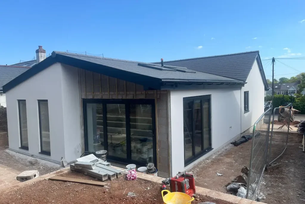 a building under construction with a blue sky